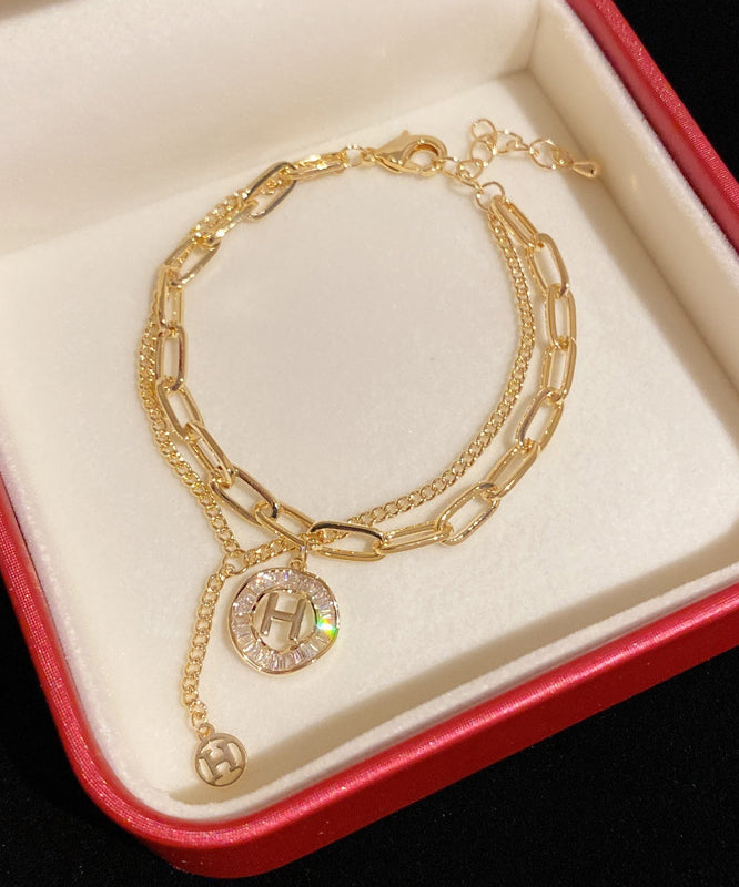 Gold Alloy Crystal Graphic Tassel Charm Bracelet