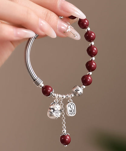 Mulberry Sterling Silver Cinnabar Tassel Charm Bracelet