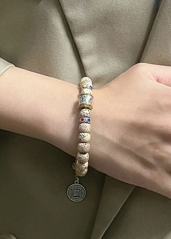 Pipal Tree Seed Fu Character Charm Bracelet
