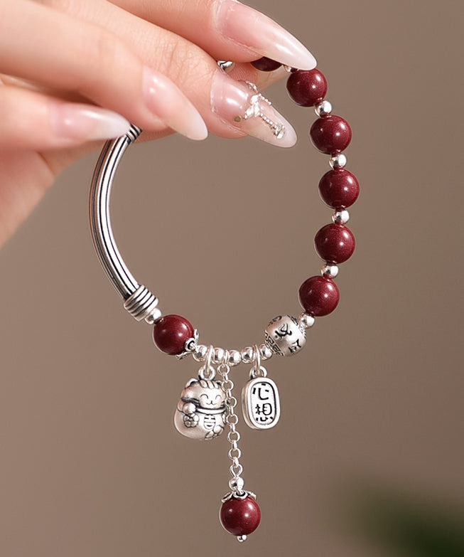 Mulberry Sterling Silver Cinnabar Tassel Charm Bracelet Kx1048