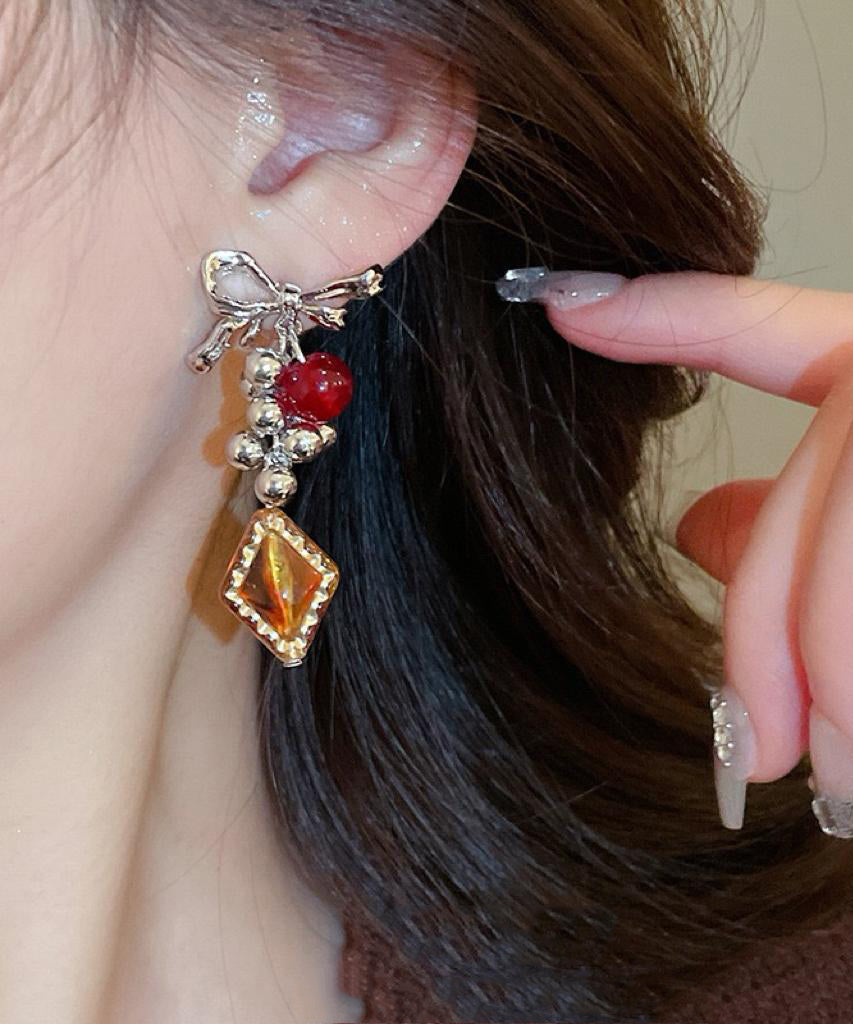 Acrylic Alloy Asymmetrical Amber Bow Tassel Drop Earrings