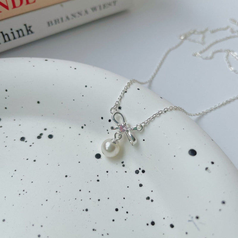 Cady Bow and Pearl Necklace