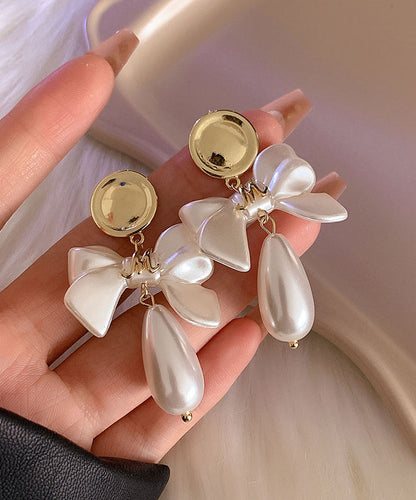 White Copper Alloy Pearl Bow Drop Earrings